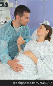 man supporting his partner through childbirth