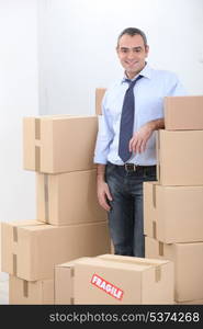 Man surrounded by boxes