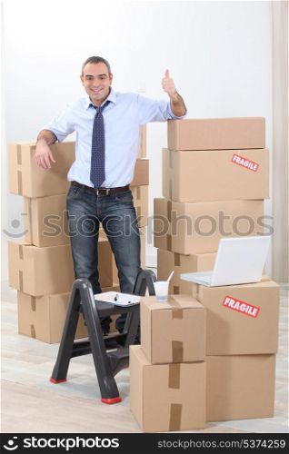 Man surrounded by cardboards