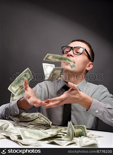 Man surrounded by money