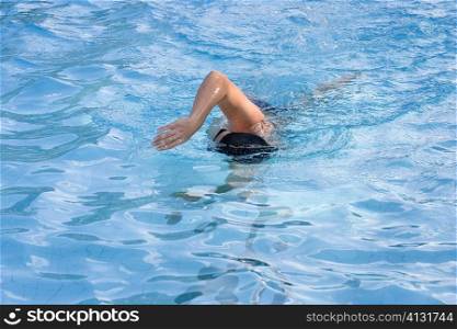 Man swimming in a swimming pool