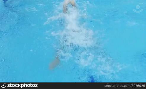 Man Swimming in Pool