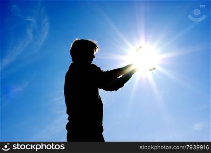 Man take sun in hands. Conceptual design.