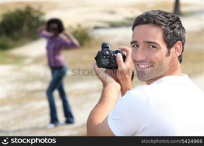 Man taking a picture of his girlfriend