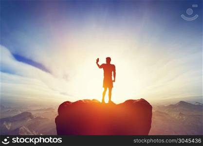 Man taking a picture or selfie with his smartphone, standing on the peak of the mountain. Mobile photography, modern media, technology concepts.. Man taking a picture, selfie with his smartphone in mountains. Mobile photography