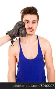 Man taking a punch with black boxing glove, isolated on white background.