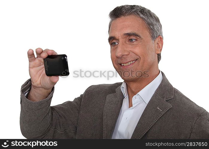 Man taking a self-portrait with his cameraphone