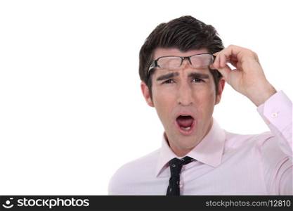 Man taking his glasses off
