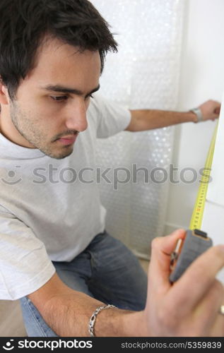 Man taking measurements