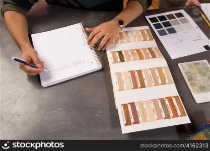 Man Taking Notes with Color Palettes