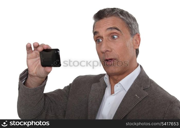 Man taking photo on mobile telephone