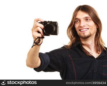 Man taking photo picture with camera.. Man taking photo picture with camera. Handsome young guy male with long hair isolated on white background.