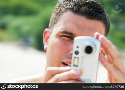 Man taking picture on holidays on the beach