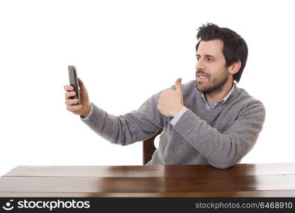 man taking selfie photo with mobile phone camera posing happy and successful isolated on white background