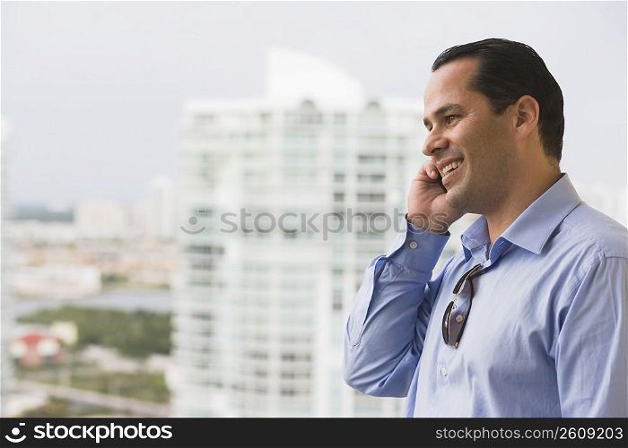 Man talking on a mobile phone and smiling
