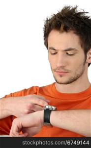 Man tapping his watch