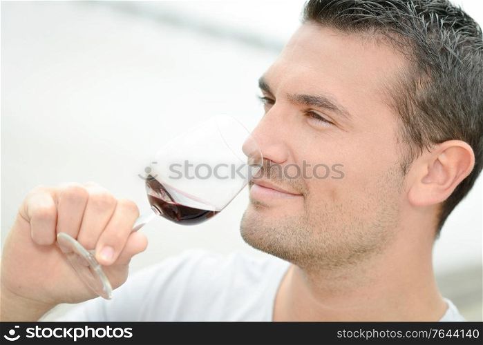 Man tasting some red wine