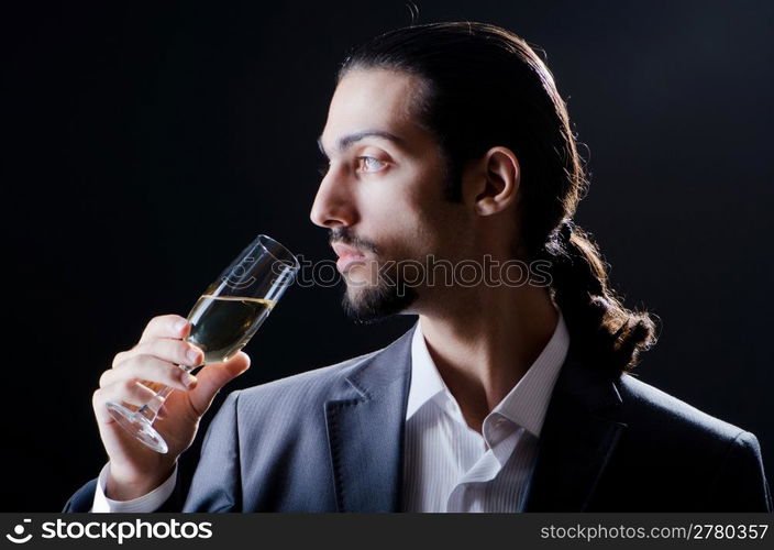 Man tasting wine in glass