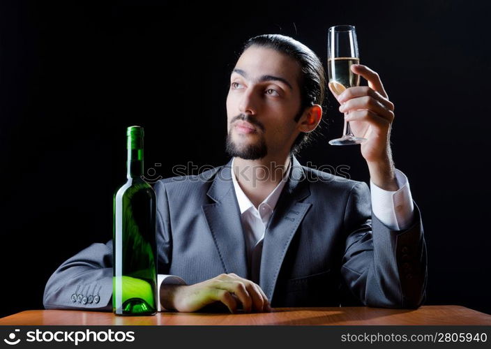 Man tasting wine in glass