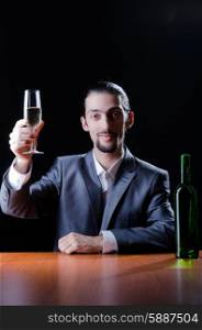 Man tasting wine in glass