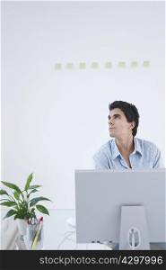 Man thinking at computer
