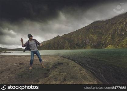 Man throwing a stone at the lake
