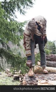 Man tie shoes in the forest