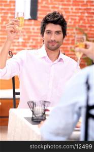 Man toasting in restaurant