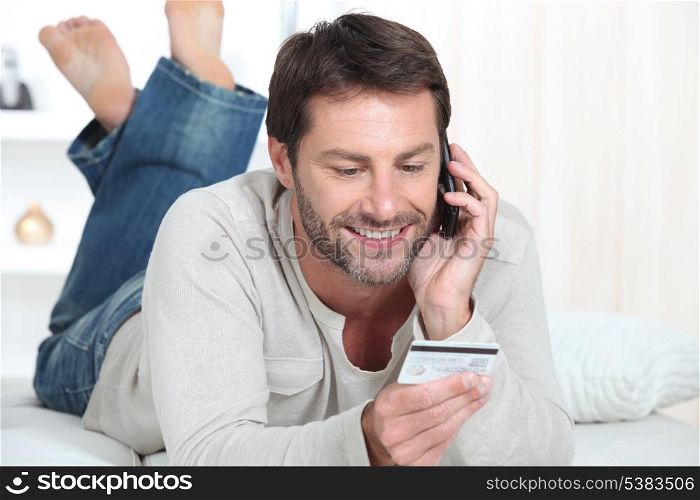 Man topping up phone