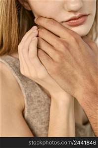 man touching woman s chin with his hand