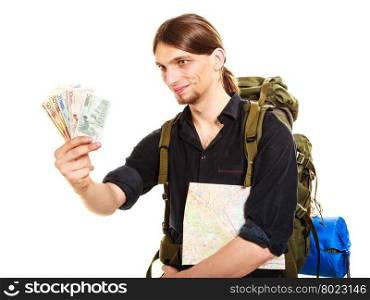 Man tourist backpacker holding euro money. Travel.. Man tourist backpacker holding euro money and map. Young guy hiker backpacking. Summer vacation travel. Isolated on white background.