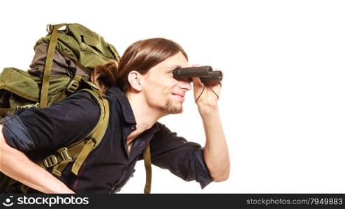 Man tourist backpacker looking through binoculars.. Man tourist backpacker looking through binoculars. Young guy hiker backpacking. Summer vacation travel. Isolated on white background.
