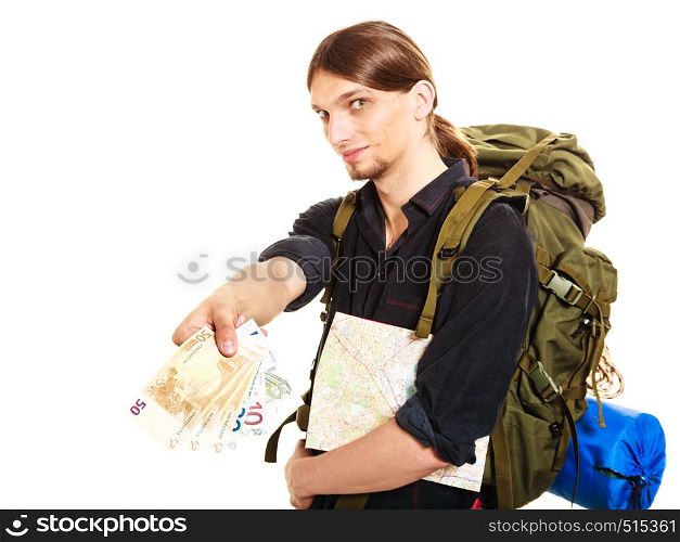 Man tourist backpacker paying with euro money holding map. Young guy hiker backpacking. Summer vacation travel. Isolated on white background.. Man tourist backpacker paying euro money. Travel.