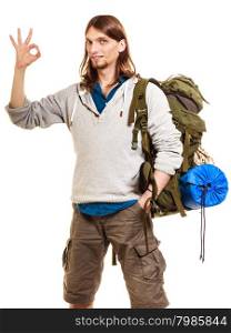 Man tourist backpacker showing ok gesture. Travel.. Portrait of man tourist backpacker on trip showing ok gesture. Young guy hiker backpacking. Summer vacation travel. Isolated on white background.