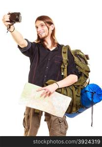 Man tourist backpacker taking photo with camera.. Man tourist backpacker on trip taking photo picture with camera. Young guy hiker backpacking holding map. Summer vacation travel. Isolated on white background.