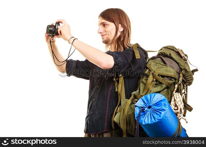 Man tourist backpacker taking photo with camera.. Man tourist backpacker on trip taking photo picture with camera. Young guy hiker backpacking. Summer vacation travel. Isolated on white background.
