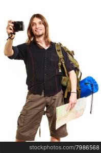 Man tourist backpacker taking photo with camera.. Man tourist backpacker on trip taking photo picture with camera. Young guy hiker backpacking holding map. Summer vacation travel. Isolated on white background.