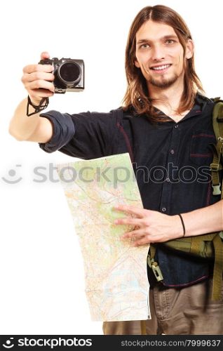 Man tourist backpacker taking photo with camera.. Man tourist backpacker taking photo picture with camera. Young guy hiker backpacking holding map. Isolated on white background.