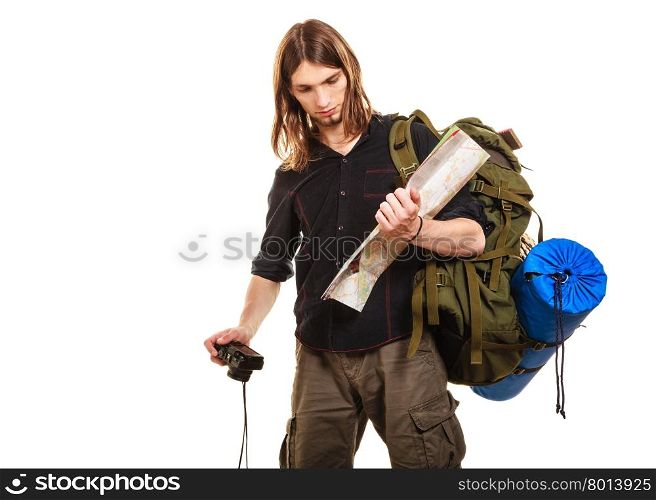 Man tourist backpacker with camera reading map.. Man tourist backpacker on trip with camera reading map. Young guy hiker backpacking. Summer vacation travel. Isolated on white background.