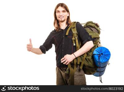 Man tourist hitchhiker with thumb up gesture.. Man tourist hitchhiker. Young guy hitchhiking with thumb up gesture. Male hiker backpacking. Summer vacation travel.