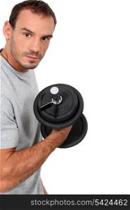 man training with a dumbbell