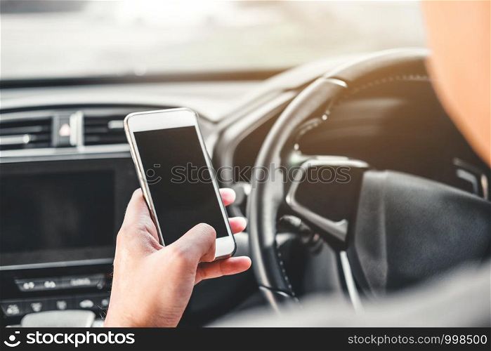 Man traveler Using Smart Phone at Car Inside