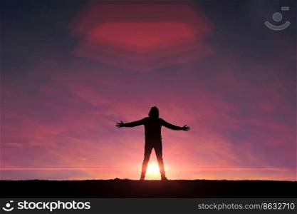 man trekking in the mountain with a sunset background in summertime