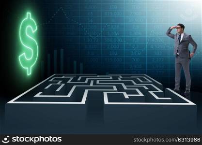 Man trying to reach dollars through maze