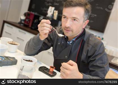 man trying to record a formula of great taste coffee