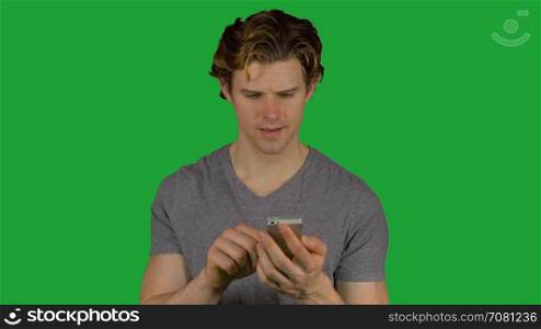 Man typing on his phone (Green Key)