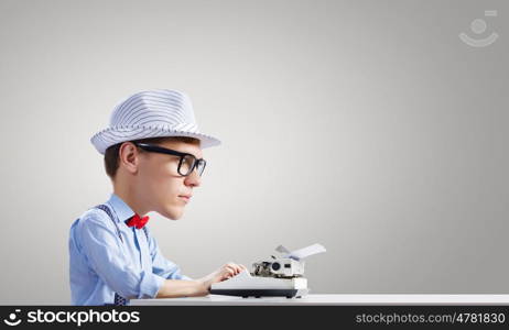 Man typist. Young funny man writer with big head
