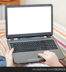 man uses laptop with cut out screen in living room