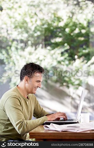 Man Using a Laptop Outside