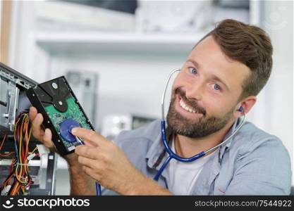 man using a stetheoscope on his pc